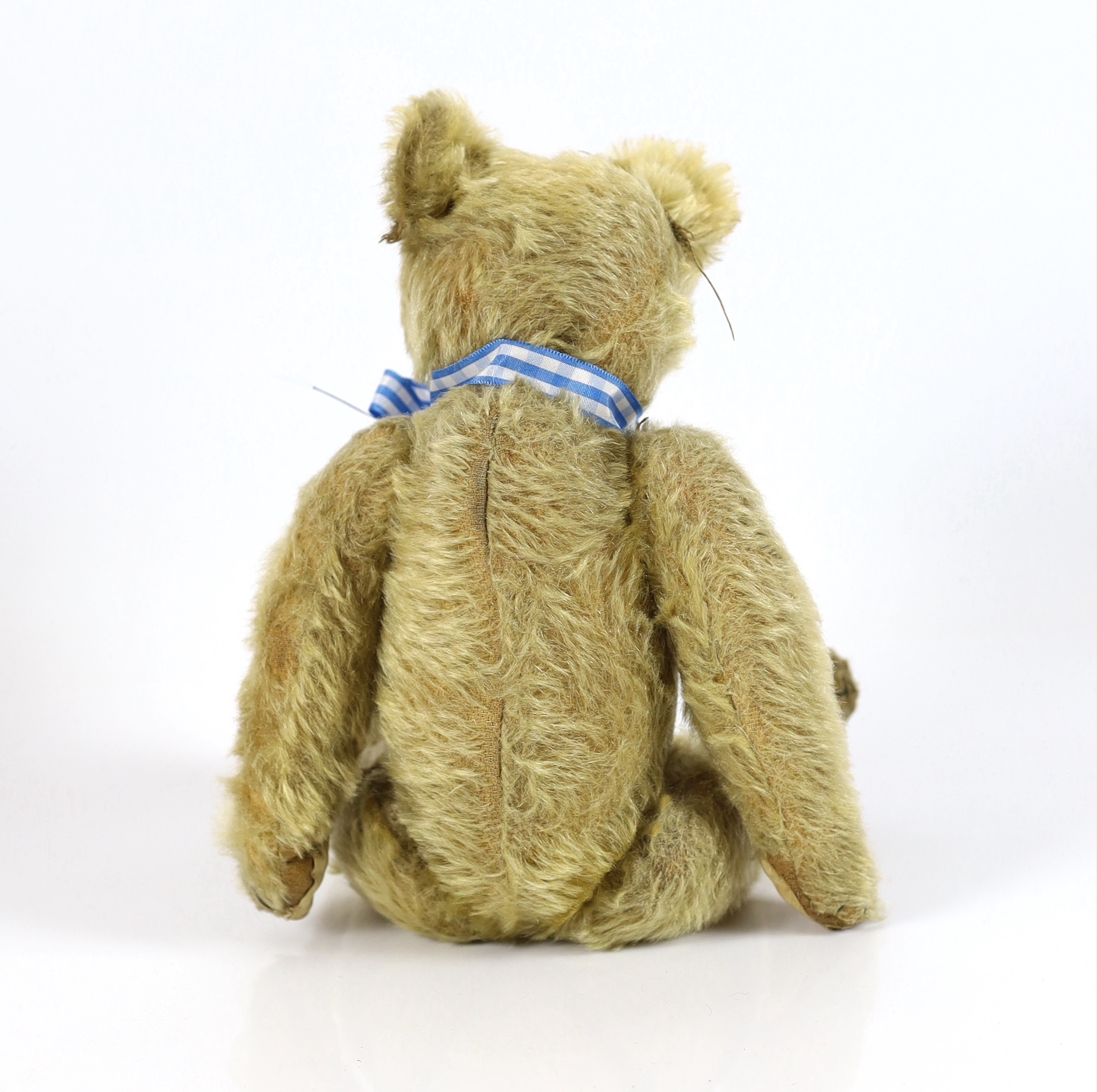 A Farnell bear, c.1912, 33cm, bear paw pads restored, hair loss to stomach